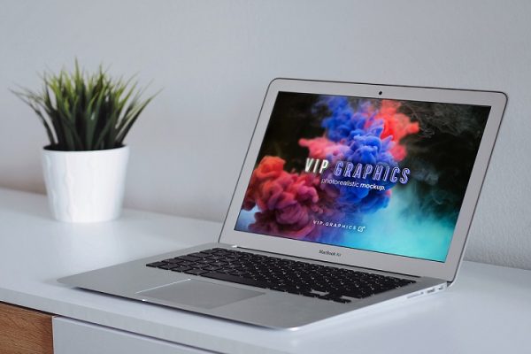 Free MacBook on Desk Mockup